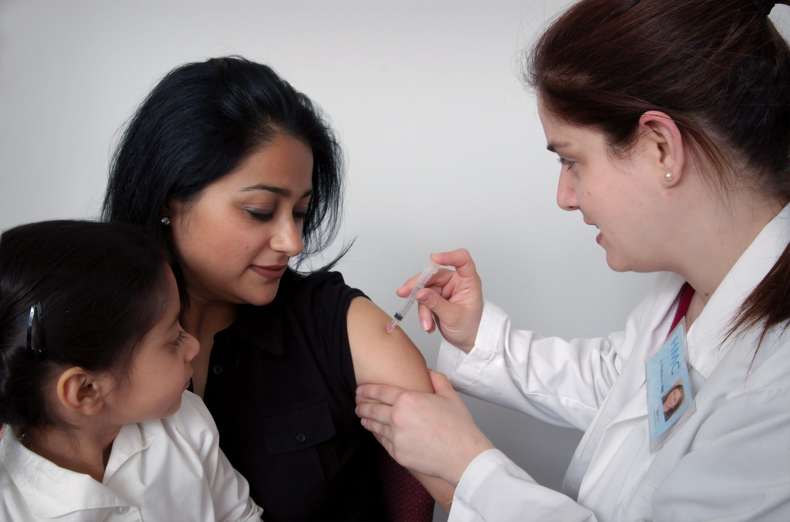 patient receiving needle in the arm
